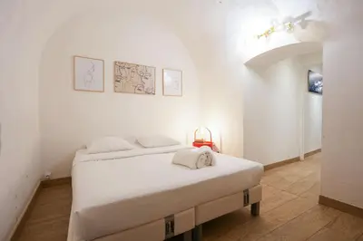 Un ou plusieurs lits dans un hébergement de l'établissement Loft 2 BR Marais, Notre Dame AC by LCC Agency