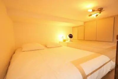 Un ou plusieurs lits dans un hébergement de l'établissement Loft 2 BR Marais, Notre Dame AC by LCC Agency