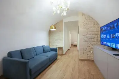 Coin salon dans l'établissement Loft 2 BR Marais, Notre Dame AC by LCC Agency