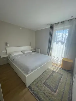 Un ou plusieurs lits dans un hébergement de l'établissement Charmant logement aux portes de Paris - STADE DE FRANCE - 12 min à pied