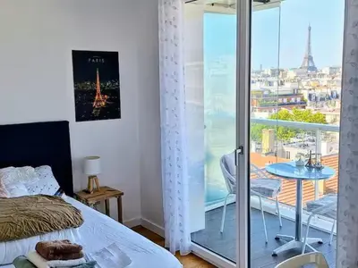 Un ou plusieurs lits dans un hébergement de l'établissement Vue exceptionnelle sur la tour Eiffel