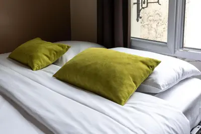 Un ou plusieurs lits dans un hébergement de l'établissement Pied-a-terre near Bastille & Voltaire Paris 11th