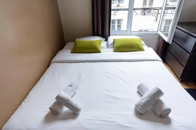 Un ou plusieurs lits dans un hébergement de l'établissement Pied-a-terre near Bastille & Voltaire Paris 11th