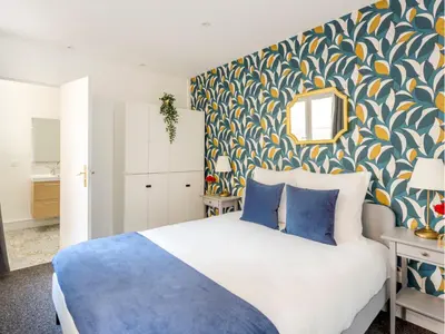 Un ou plusieurs lits dans un hébergement de l'établissement Merveil - Family Suite - Marais - Saint Denis II