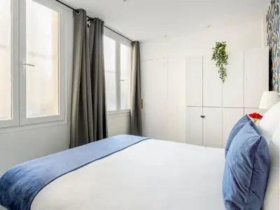 Un ou plusieurs lits dans un hébergement de l'établissement Merveil - Family Suite - Marais - Saint Denis II