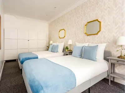 Un ou plusieurs lits dans un hébergement de l'établissement Merveil - Family Suite - Marais - Saint Denis II