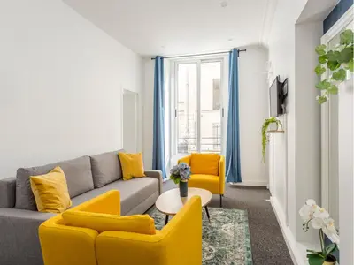 Coin salon dans l'établissement Merveil - Family Suite - Marais - Saint Denis II
