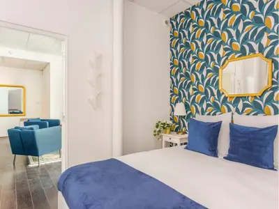 Un ou plusieurs lits dans un hébergement de l'établissement Merveil - Family Suite - Marais - Sebastopol III