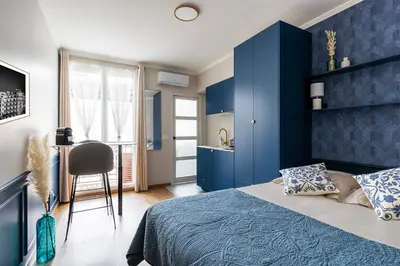 Un ou plusieurs lits dans un hébergement de l'établissement Appart Hôtel Résidence Courcelle