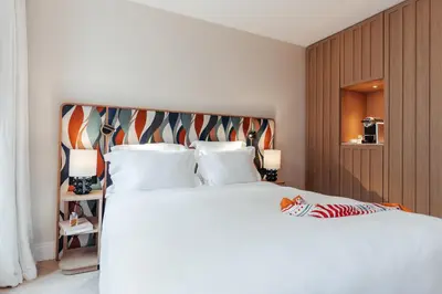 Un ou plusieurs lits dans un hébergement de l'établissement Padam Hôtel