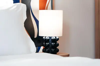 Un ou plusieurs lits dans un hébergement de l'établissement Padam Hôtel