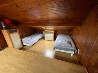Un ou plusieurs lits dans un hébergement de l'établissement Agréable appartement dans une maison