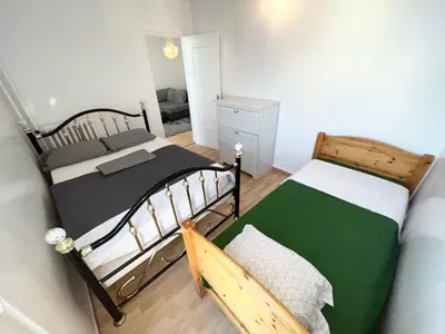 Un ou plusieurs lits dans un hébergement de l'établissement Superbe appartement près du métro 4 proche Paris