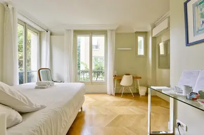 Un ou plusieurs lits dans un hébergement de l'établissement La Villa d'Auteuil, Paris 16