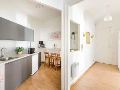 Cuisine ou kitchenette dans l'établissement Merveil - Family Suite - Champs Elysees - Mollien