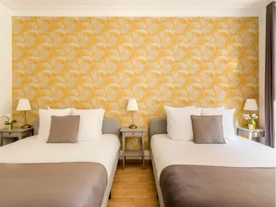 Un ou plusieurs lits dans un hébergement de l'établissement Merveil - Family Suite - Champs Elysees - Mollien