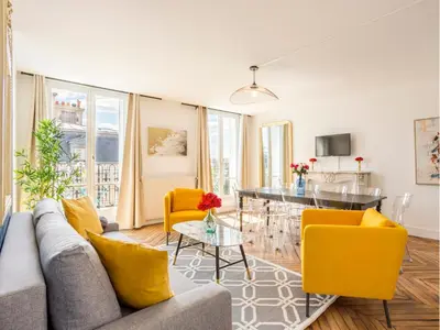 Coin salon dans l'établissement Merveil Family Suite - Tilsitt - Eiffel Tower view