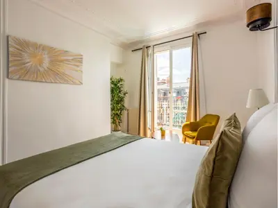 Un ou plusieurs lits dans un hébergement de l'établissement Merveil Family Suite - Tilsitt - Eiffel Tower view
