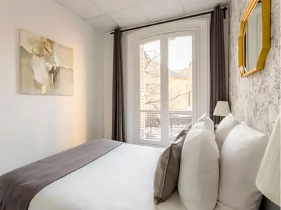 Un ou plusieurs lits dans un hébergement de l'établissement Merveil - Family Suite - Marais - Turbigo I