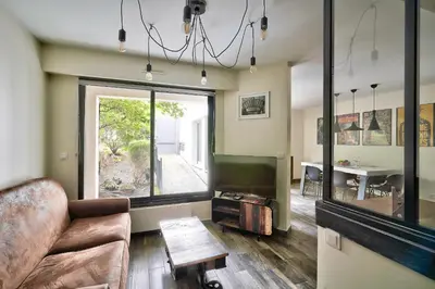 Coin salon dans l'établissement ParisConciergerie - 2BR apartment 4 people