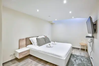 Un ou plusieurs lits dans un hébergement de l'établissement ParisConciergerie - 2BR apartment 4 people