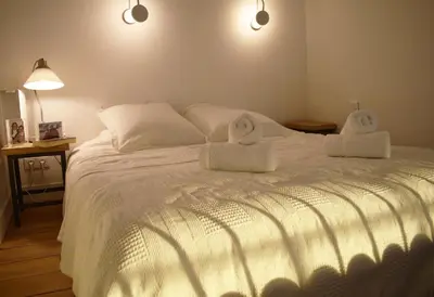 Un ou plusieurs lits dans un hébergement de l'établissement Artist Loft