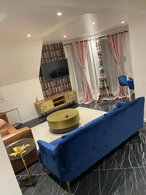 Coin salon dans l'établissement APPARTEMENT AVEC VUE SUR LA TOUR EIIFEL