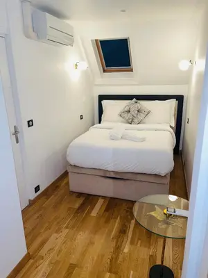 Un ou plusieurs lits dans un hébergement de l'établissement APPARTEMENT AVEC VUE SUR LA TOUR EIIFEL