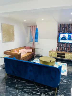 Coin salon dans l'établissement APPARTEMENT AVEC VUE SUR LA TOUR EIIFEL