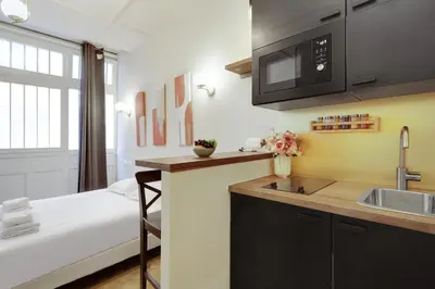 Cuisine ou kitchenette dans l'établissement Cozy studio - 2P - Gare de l'Est