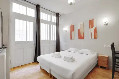 Un ou plusieurs lits dans un hébergement de l'établissement Cozy studio - 2P - Gare de l'Est