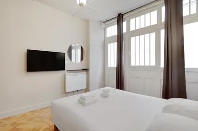 Un ou plusieurs lits dans un hébergement de l'établissement Cozy studio - 2P - Gare de l'Est