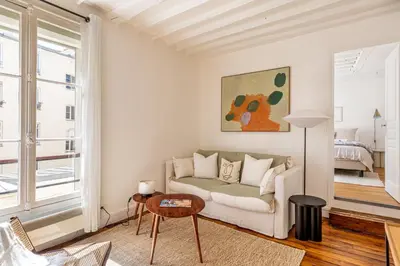 Un ou plusieurs lits dans un hébergement de l'établissement GuestReady - Apt de charme dans le centre de Paris IX