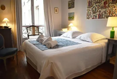 Un ou plusieurs lits dans un hébergement de l'établissement Montparnasse - Palace