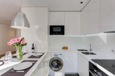 Cuisine ou kitchenette dans l'établissement Champs Elysées Apartment