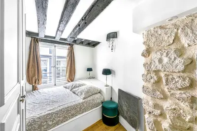 Un ou plusieurs lits dans un hébergement de l'établissement Grands Boulevards - Vivienne 1bdr
