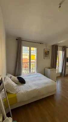 Un ou plusieurs lits dans un hébergement de l'établissement Appartement a Paris