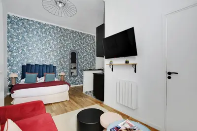 Télévision ou salle de divertissement dans l'établissement CMG Résidence Bastille - Saint Antoine