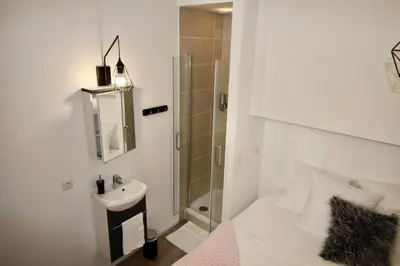 Un ou plusieurs lits dans un hébergement de l'établissement Sweet Virtue-Center of Paris, 2 Bedroom apartment