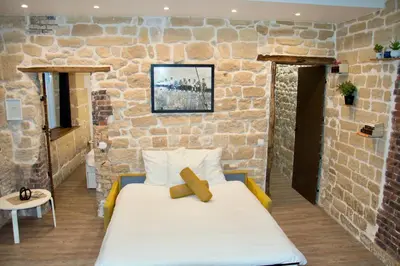 Un ou plusieurs lits dans un hébergement de l'établissement Sweet Virtue-Center of Paris, 2 Bedroom apartment