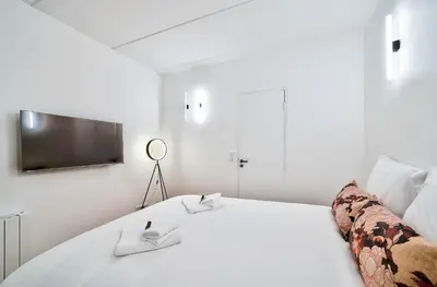Un ou plusieurs lits dans un hébergement de l'établissement Splendide appartement pour 6 proche Montmartre