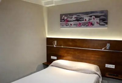 Un ou plusieurs lits dans un hébergement de l'établissement Hotel des Pyrénées