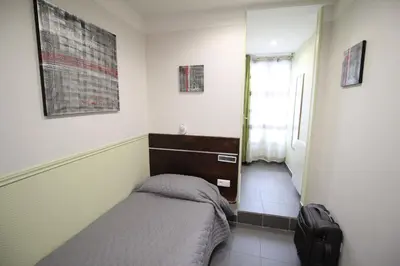 Un ou plusieurs lits dans un hébergement de l'établissement Hotel des Pyrénées