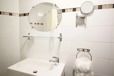 Salle de bains dans l'établissement Hotel des Pyrénées