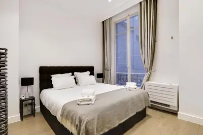 Un ou plusieurs lits dans un hébergement de l'établissement Pick A Flat's Apartment in Triangle d'Or - Pierre 1er de Serbie