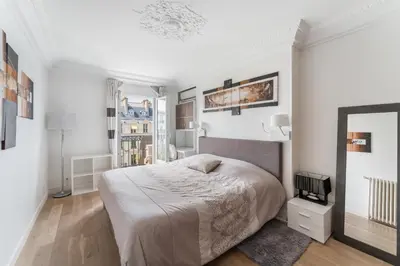 Un ou plusieurs lits dans un hébergement de l'établissement Appartement Haussmannien - dernier étage