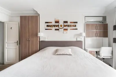 Un ou plusieurs lits dans un hébergement de l'établissement Appartement Haussmannien - dernier étage