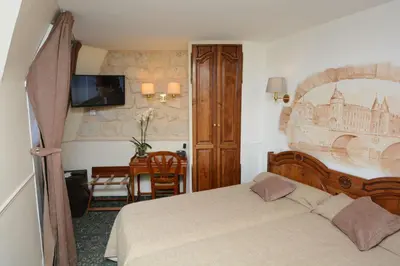 Un ou plusieurs lits dans un hébergement de l'établissement Familia Hotel