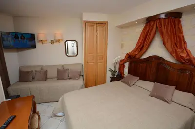 Un ou plusieurs lits dans un hébergement de l'établissement Familia Hotel