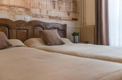 Un ou plusieurs lits dans un hébergement de l'établissement Familia Hotel